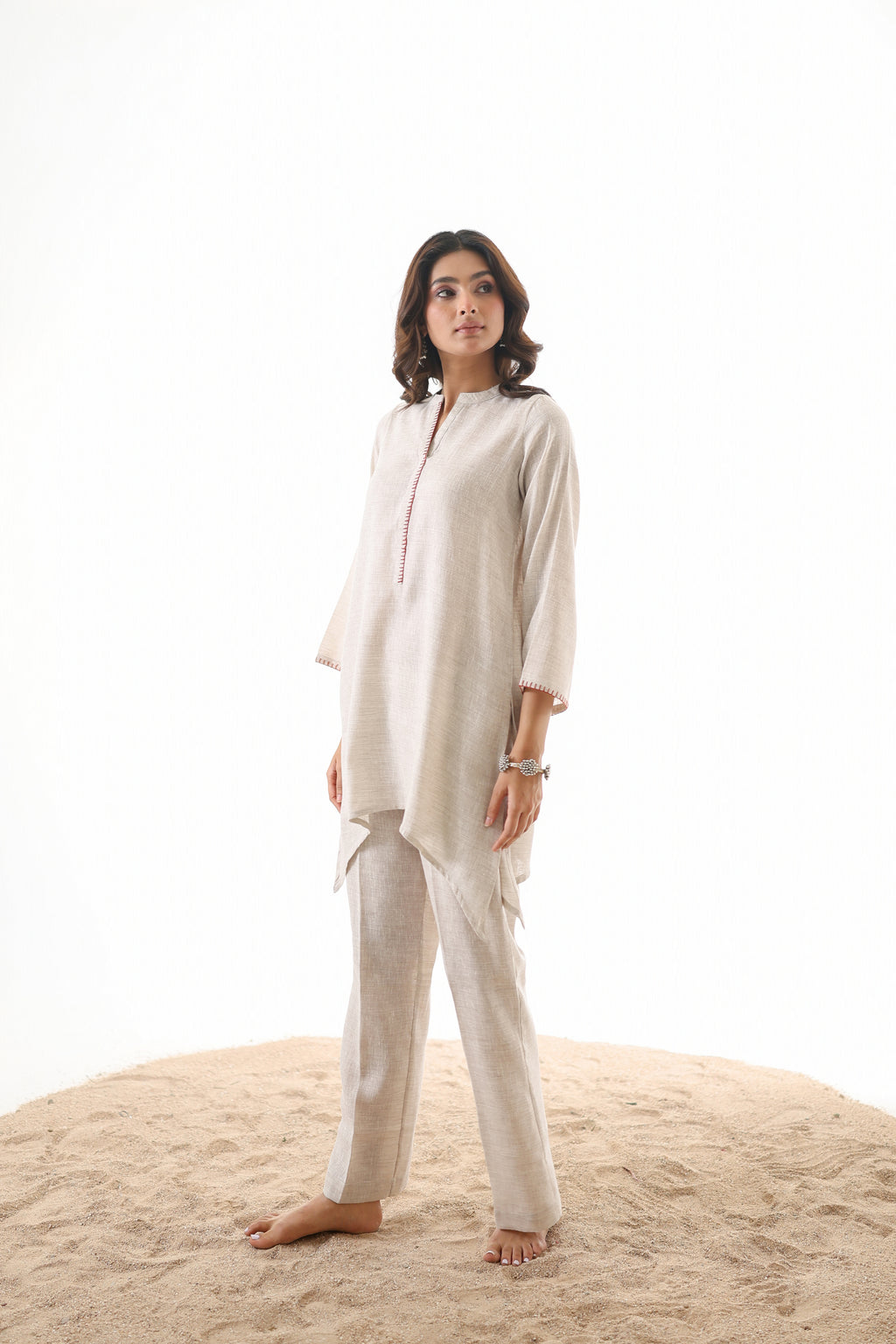 Aks Asymmetric Hem Co-ord Set with Flared Pants & Handwork Detailing - Almond Dust